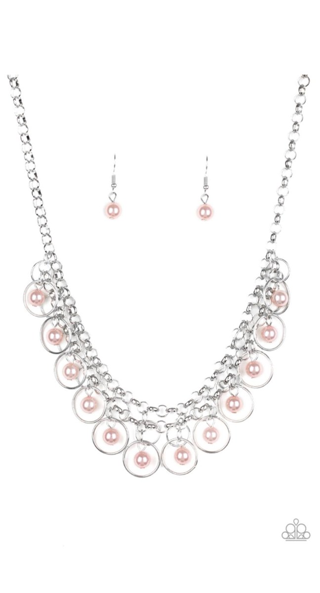 Silver-tone statement necklace with delicate pink accents and coordinating earrings, shown as evening-style inspiration